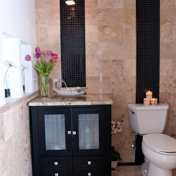 Stone Bath with Black Mosaic Accents