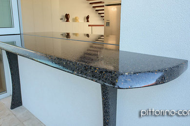 Contemporary kitchen in Sydney with concrete benchtops.