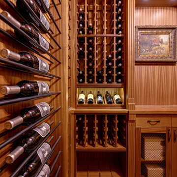 Secret passageway wine cellar. Basement layout with all mahogany racking.