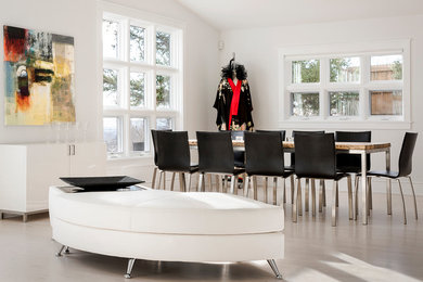 Inspiration for a contemporary light wood floor dining room remodel in Denver with white walls
