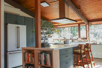 Large 1960s l-shaped porcelain tile, gray floor and wood ceiling eat-in kitchen photo in Boston with an undermount sink, flat-panel cabinets, blue cabinets, concrete countertops, multicolored backsplash, ceramic backsplash, white appliances, an island and white countertops