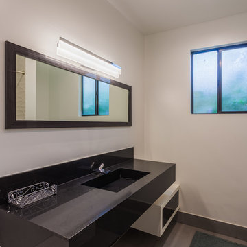 Black Stone Vanity With Framed Mirror and Floating Shelf