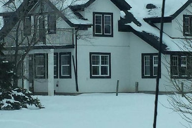 Example of a cottage exterior home design in Edmonton