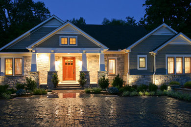 Mid-sized craftsman beige one-story vinyl exterior home idea in Other