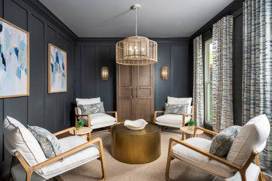 Beach style enclosed carpeted, beige floor and wall paneling family room photo in Charlotte with black walls