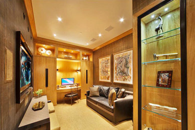 Example of a mid-sized trendy built-in desk carpeted and beige floor home studio design in New York with brown walls