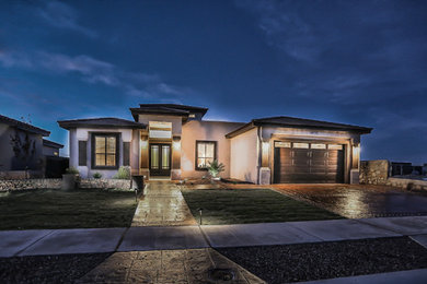 Mid-sized transitional beige one-story stucco exterior home idea in Austin with a hip roof