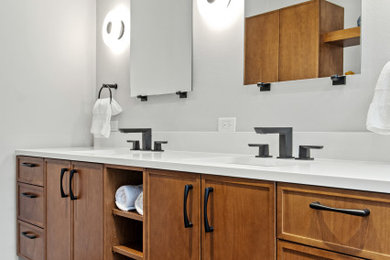 Mid-sized mid-century modern master blue tile and ceramic tile porcelain tile, black floor and double-sink bathroom photo in Dallas with recessed-panel cabinets, medium tone wood cabinets, gray walls, an undermount sink, quartz countertops, a hinged shower door, white countertops and a floating vanity