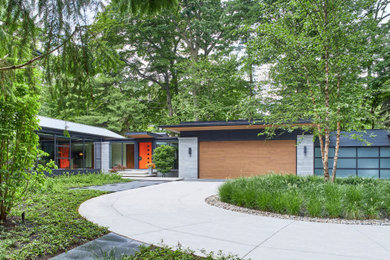 Huge trendy multicolored one-story mixed siding house exterior photo in Toronto