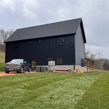 Modern Barn Style New Home Build with Wraparound Porch and Timber Beams