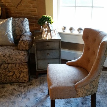 Living area, sectional sofa, exposed brick, metallics