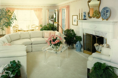 Inspiration for a mid-sized transitional formal and enclosed carpeted living room remodel in Chicago with white walls, a standard fireplace and a stone fireplace