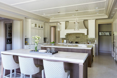 Eat-in kitchen - large transitional u-shaped ceramic tile and gray floor eat-in kitchen idea in Other with a double-bowl sink, raised-panel cabinets, white cabinets, marble countertops, beige backsplash, ceramic backsplash, stainless steel appliances and two islands