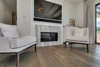 Living room - large contemporary enclosed painted wood floor living room idea in Miami with gray walls, no fireplace and a wall-mounted tv