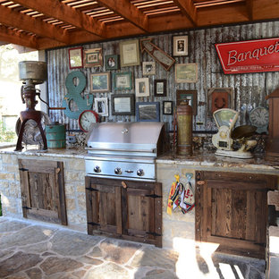 Inspiration for a mid-sized traditional backyard patio in Austin with an outdoor kitchen, concrete slab and a pergola.