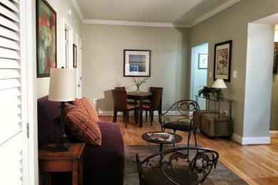 Example of a small transitional formal and open concept light wood floor living room design in DC Metro with gray walls, no fireplace and no tv