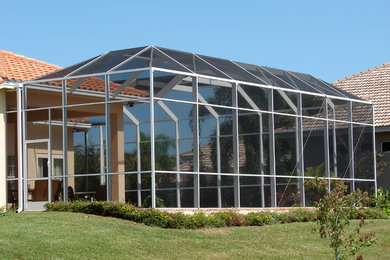 Mansard roof style pool enclosure