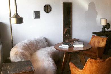 Inspiration for a small southwestern formal and open concept dark wood floor and brown floor living room remodel in Los Angeles with white walls, no fireplace and no tv