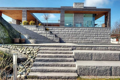 Example of a mid-sized minimalist patio design in Other