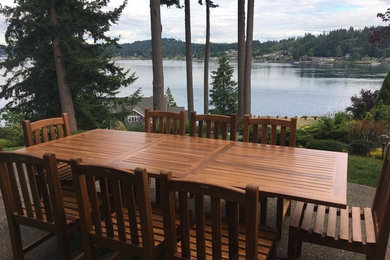 Example of a mid-sized classic backyard concrete patio design in Seattle with no cover