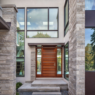 Entry featuring Stone, Stucco and Glass with Mahogany Front Door with Stainless