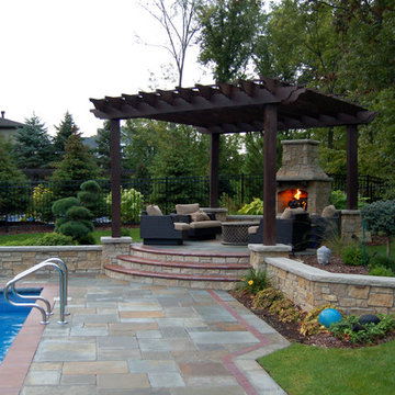 Bluestone pool decks, arbors, fireplaces, outdoor kitchen & pavilion