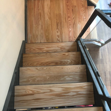 Luxury Vinyl, Baseboard and Custom Oak Staircase