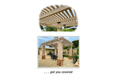 Mid-sized backyard stone patio photo in Los Angeles with a pergola