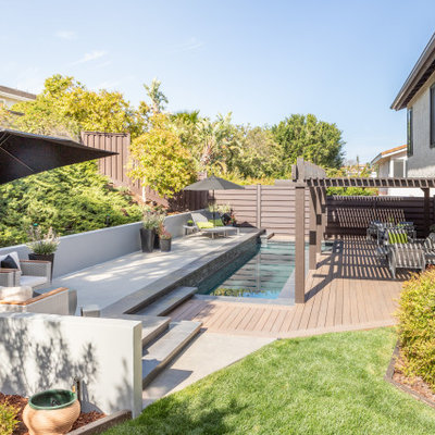 Inspiration for a contemporary rectangular pool remodel in Los Angeles with decking