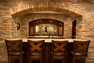 Example of a galley porcelain tile seated home bar design in Philadelphia