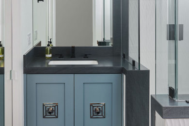 Small minimalist 3/4 white tile and ceramic tile ceramic tile, blue floor and single-sink corner shower photo in Other with shaker cabinets, blue cabinets, a one-piece toilet, white walls, an undermount sink, granite countertops, a hinged shower door, blue countertops and a floating vanity