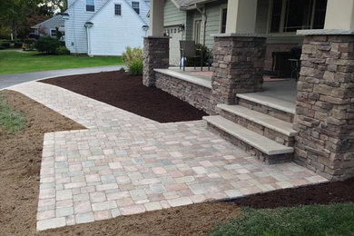 Design ideas for a front yard brick garden path in New York.