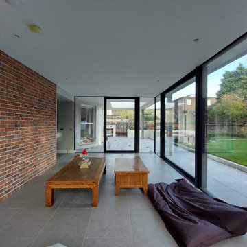 Contemporary glazed extension connects historic house to garden