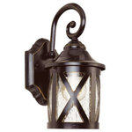 Trans Globe Lighting - Chandler 12.75" Wall Lantern - The Chandler Collection exhibits a unique wall lantern that is perfect for adding supplemental lighting to any outdoor living space. The Traditional tone allows the lantern to stand out as both functional and decorative as it lights up any outdoor setting.  The Chandler 12.75" Wall Lantern is a single-light fixture with a clear Seeded Glass shade that creates soft reflections across the landscape.  A cross bar trim over the shade adds rustic appeal.  A decorative wall bracket with scroll arm suspends this classic coach style lantern.  The Chandler Collection is finished in Rubbed Oil Bronze.