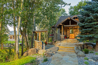 Mid-sized farmhouse exterior home idea in Other