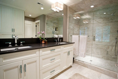 Mid-sized transitional master bathroom in Nashville with recessed-panel cabinets, white cabinets, an alcove shower, beige tile, stone tile, grey walls, travertine floors, an undermount sink and granite benchtops.
