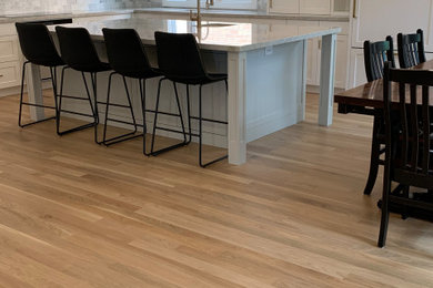 Kitchen - modern beige floor kitchen idea in Other with an island