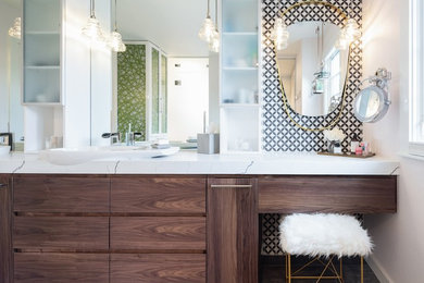Corner shower - large 1960s master white tile and ceramic tile ceramic tile and gray floor corner shower idea in Denver with flat-panel cabinets, brown cabinets, a two-piece toilet, white walls, a vessel sink, quartz countertops, a hinged shower door and white countertops