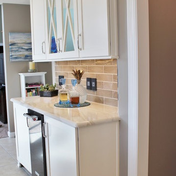 Quad Cities Kitchen With Gray Base Cabinets and Waterfall Counters