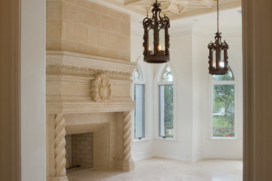 This is an example of a large mediterranean formal enclosed living room in Orlando with beige walls, porcelain floors, a standard fireplace, a stone fireplace surround and beige floor.