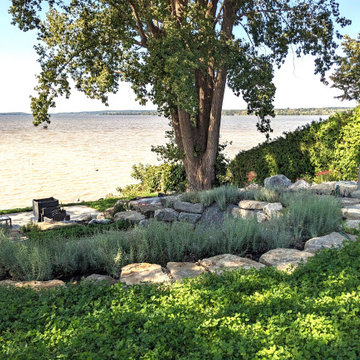 Waterfront backyard landscaping and sunroom extension