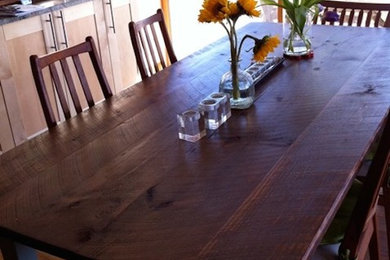 Example of a medium tone wood floor dining room design in Boston