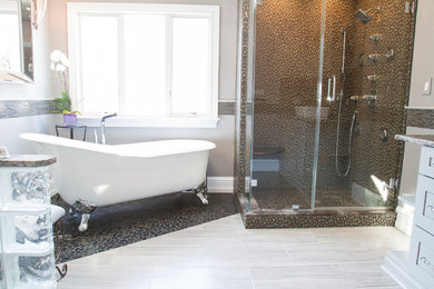 Example of a large trendy master gray tile and matchstick tile porcelain tile bathroom design in New York with a vessel sink, recessed-panel cabinets, gray cabinets, granite countertops, a one-piece toilet and gray walls