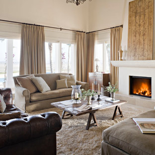 This is an example of a large mediterranean formal enclosed living room in Madrid with beige walls, a standard fireplace, carpet, a plastered fireplace surround and no tv.