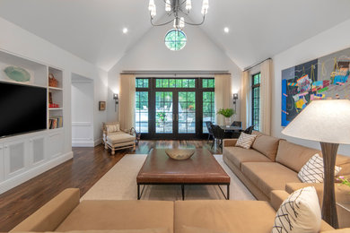 Living room - mid-sized transitional enclosed dark wood floor and brown floor living room idea in Detroit with white walls, no fireplace and a media wall