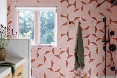 Drop-in bathtub - eclectic kids' pink tile and cement tile single-sink drop-in bathtub idea in San Francisco with flat-panel cabinets, light wood cabinets, quartzite countertops, white countertops and a built-in vanity