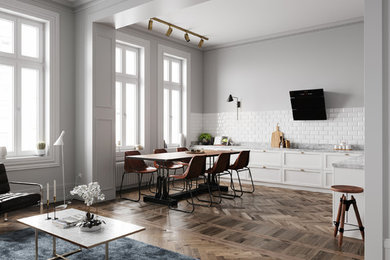 This is an example of an industrial loft-style living room in Turin with grey walls and dark hardwood floors.