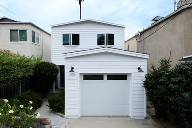 Example of a small farmhouse white two-story wood exterior home design in Los Angeles with a shingle roof