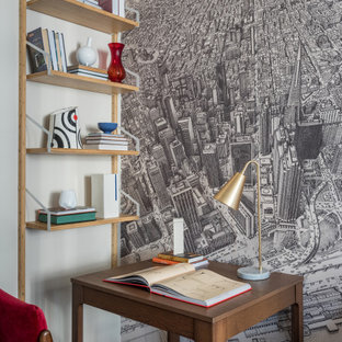 Inspiration for a small contemporary study room in Moscow with laminate floors, a freestanding desk, black floor and grey walls.