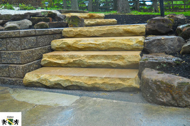 Inspiration for a rustic front yard concrete paver landscaping in Cleveland.